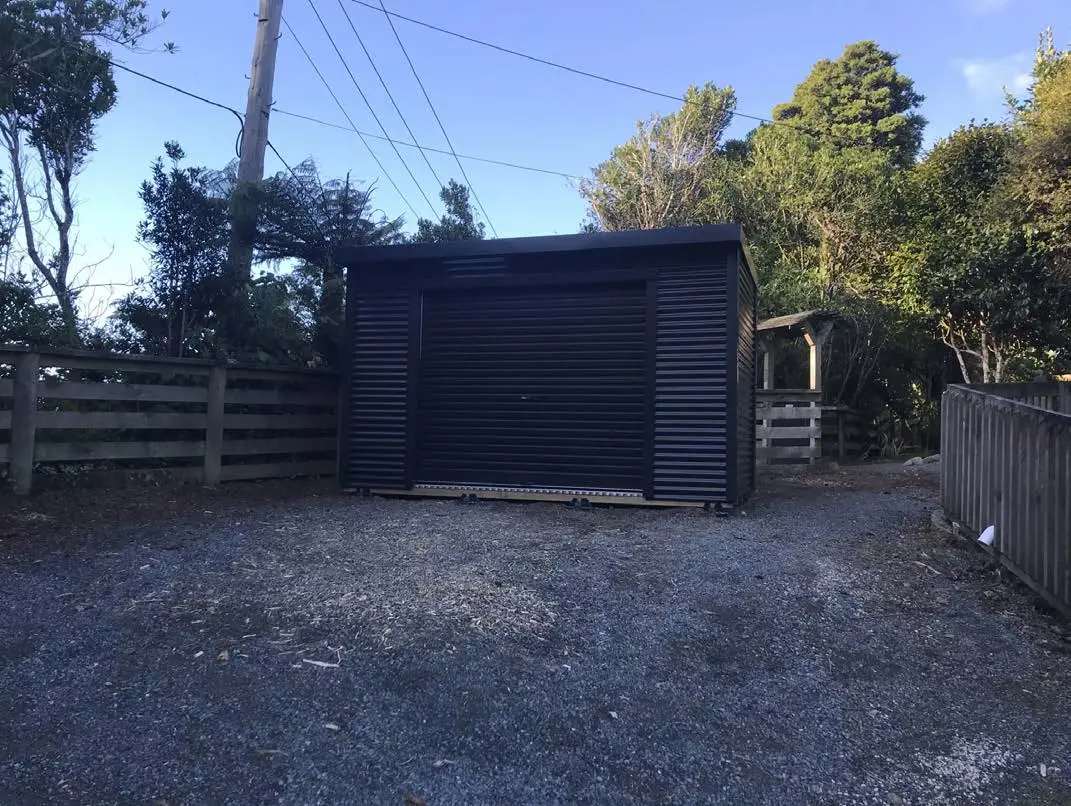 Black roller-door Lifestyle shed in Christchurch
